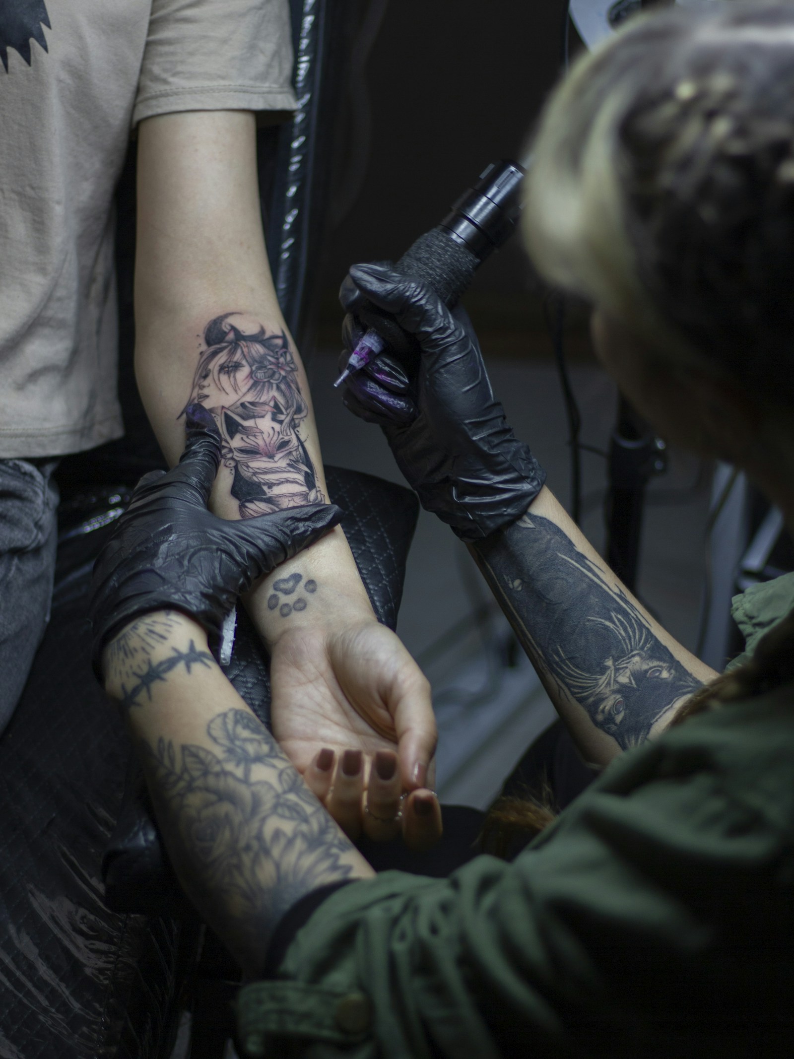 Dark atmospheric artist inking session at The Road Ink Tattoo Ubud